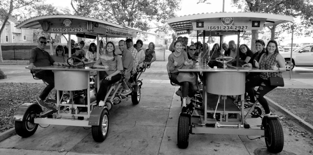 Two Brew Bikes with a large team building group